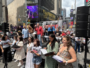 Adam-Pascal-performing-Let-the-Sun-Shine-In--at-Broadway-Day-in Times-Square.jpg